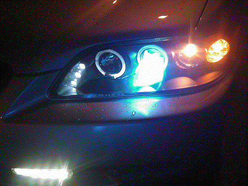 Aftermarket headlights with led halo rings. Also put HIDs in and LED fog lights
