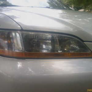 headlight (after restoration)::

sanding paper of 3 different grits...47 minutes of aggravation...one happy look