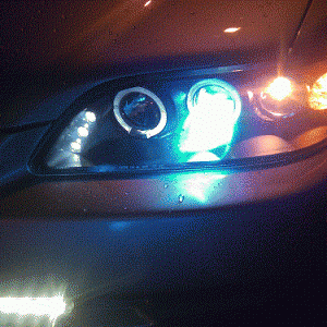 Aftermarket headlights with led halo rings. Also put HIDs in and LED fog lights