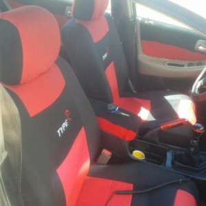 Type R seat covers from ebay. Wrapped insert for the doors. warped arm rest.  Not a bad fit up front the rear could be better though. This is an older
