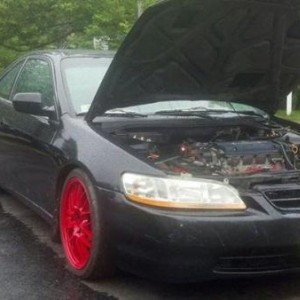 98 coupe f20b,function and forum type one coilovers, rays volk se37 k wheels...  tuned on motes demon 8 psi in near future