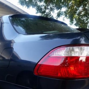 Installed trunk spoiler and rear visor spoiler.