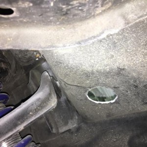 driver side hole route to fender for headlight harness