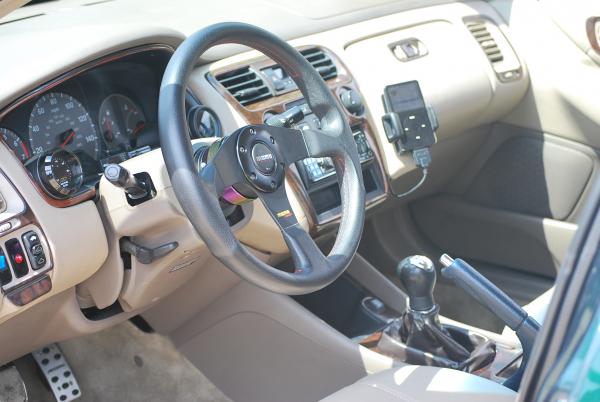 AEM gauges, ipod custom leather holder, short shift kit.
