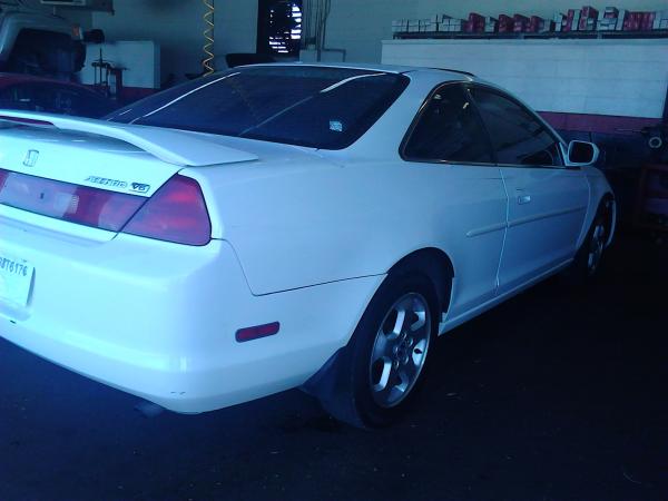 at the shop before i got her...even though the guy was cool we still had to check out...for 14 years old this had to be one of the best running cars e