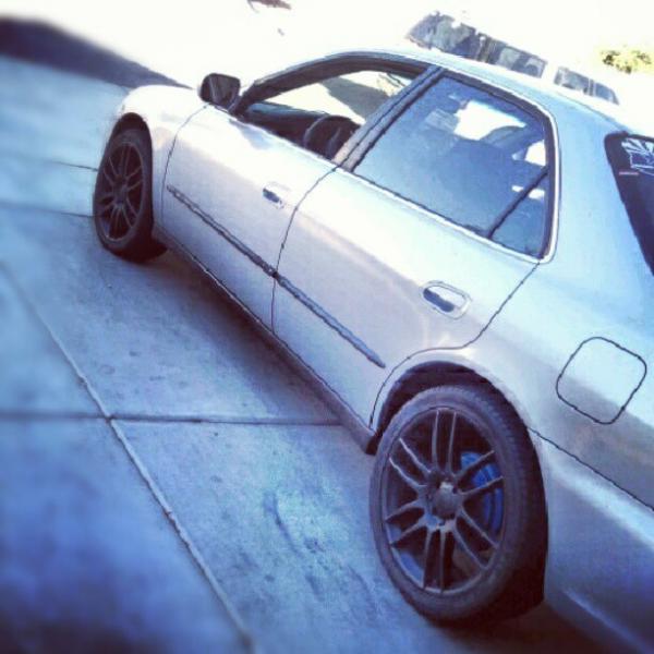 black rims blue caliper and drums