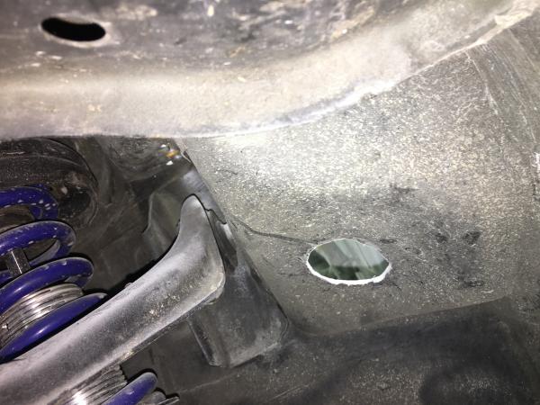 driver side hole route to fender for headlight harness
