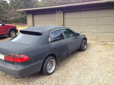 Got everything on, didnt exactly come out how i imagined it but not bad for 25$ worth of paint and 43$ for the rear spoiler and side mirror flares.