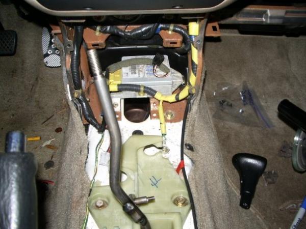 here is a shot of the 5 speed shifter assembly installed, now directly in front of that is a cutout for the auto cable, Honda made it easy and the cut