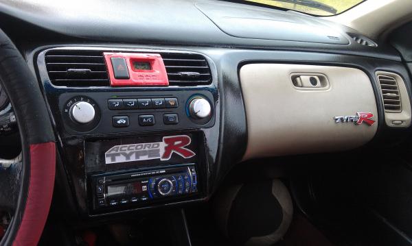 More Plasti Dip! The center console I took out and painted a glossier black. The decal in the center I made from printing out the logo, laminating it,